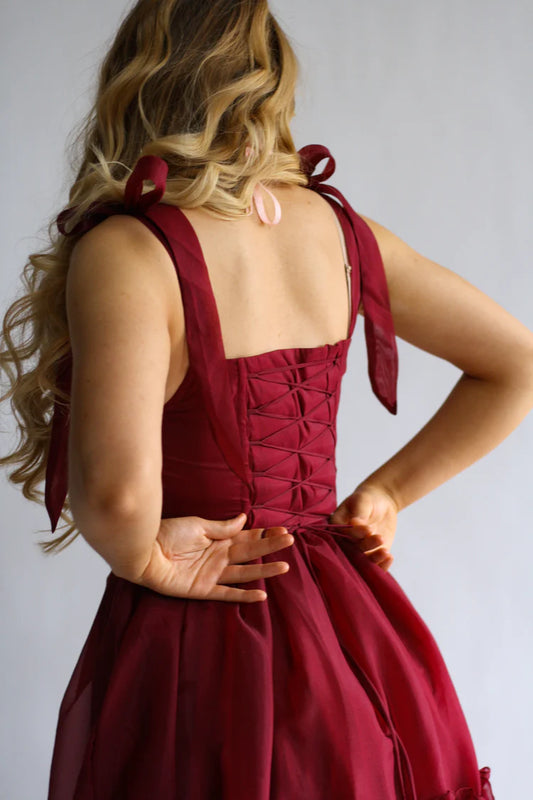 Saffira — Vestido maxi corset con volantes y lazos