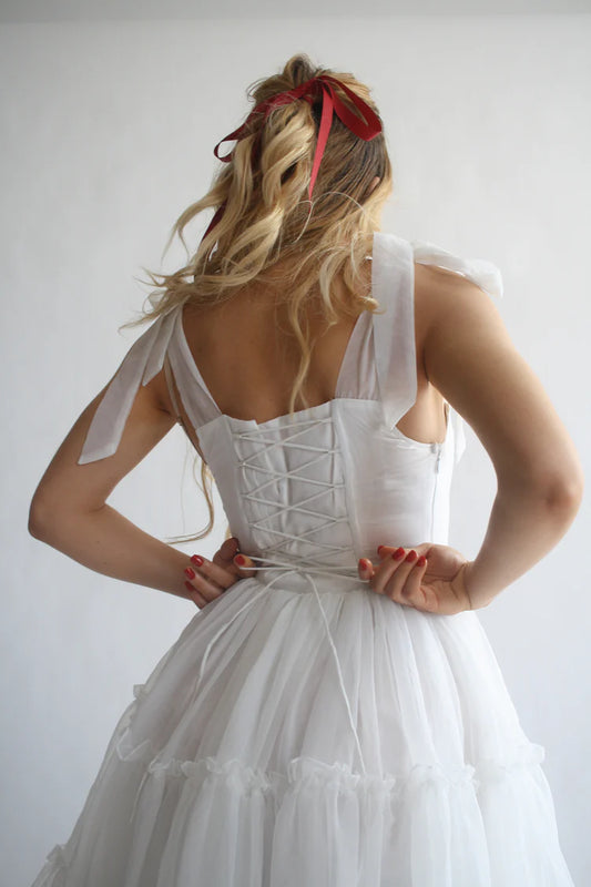 Saffira — Vestido midi corset con volantes y lazos