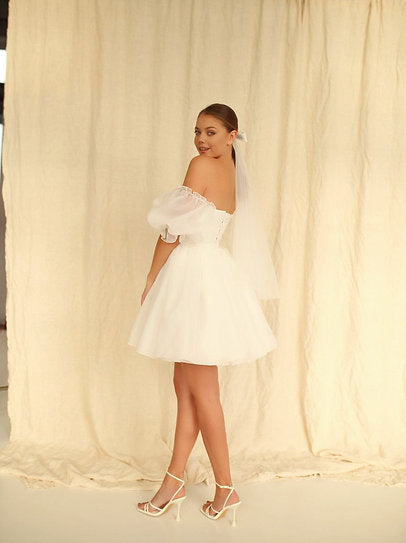 Séraphine — Vestido mini corset con mangas abullonadas y moños