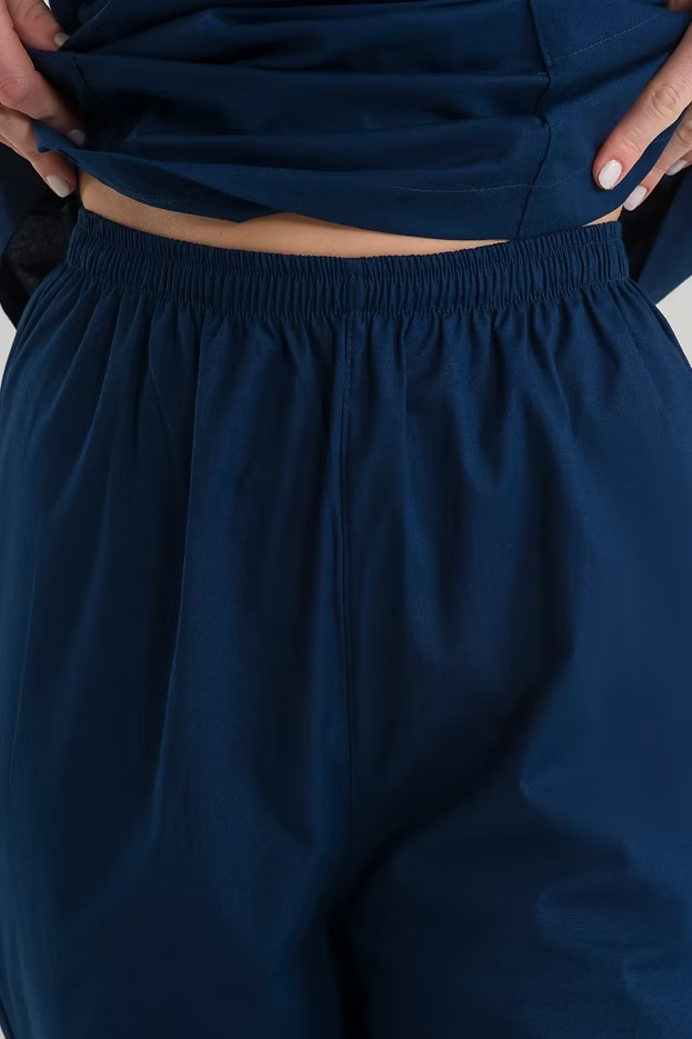 Anastasia — Uniforme con pantalón encauchado