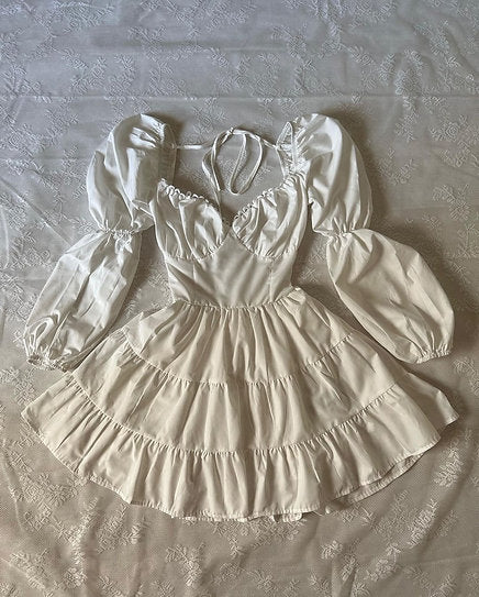 Antonella — Vestido mini con espalda descubierta y lazo