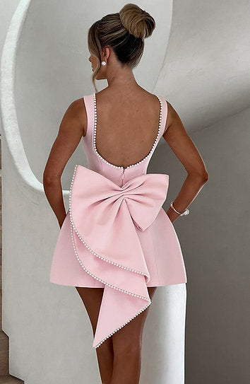 Avril — Vestido mini con perlas y moño