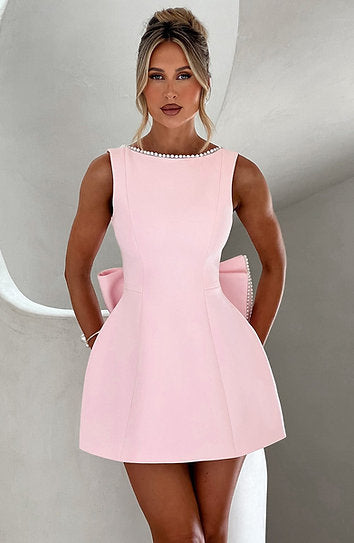 Avril — Vestido mini con perlas y moño
