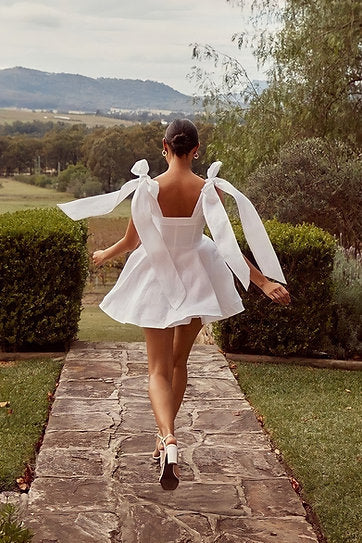 Bellina — Vestido mini con lazos