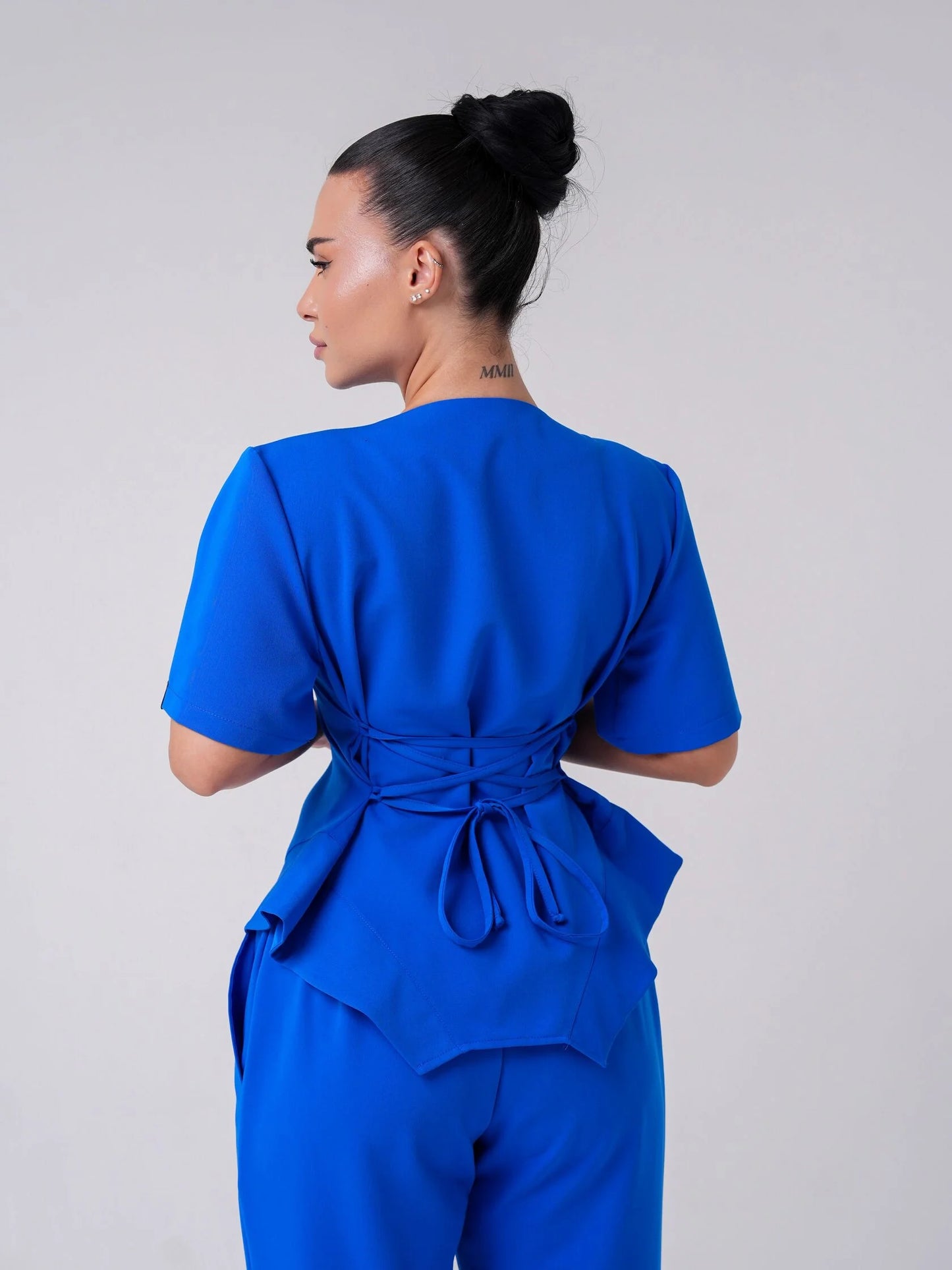 Lía — Uniforme con pantalón encauchado y corset
