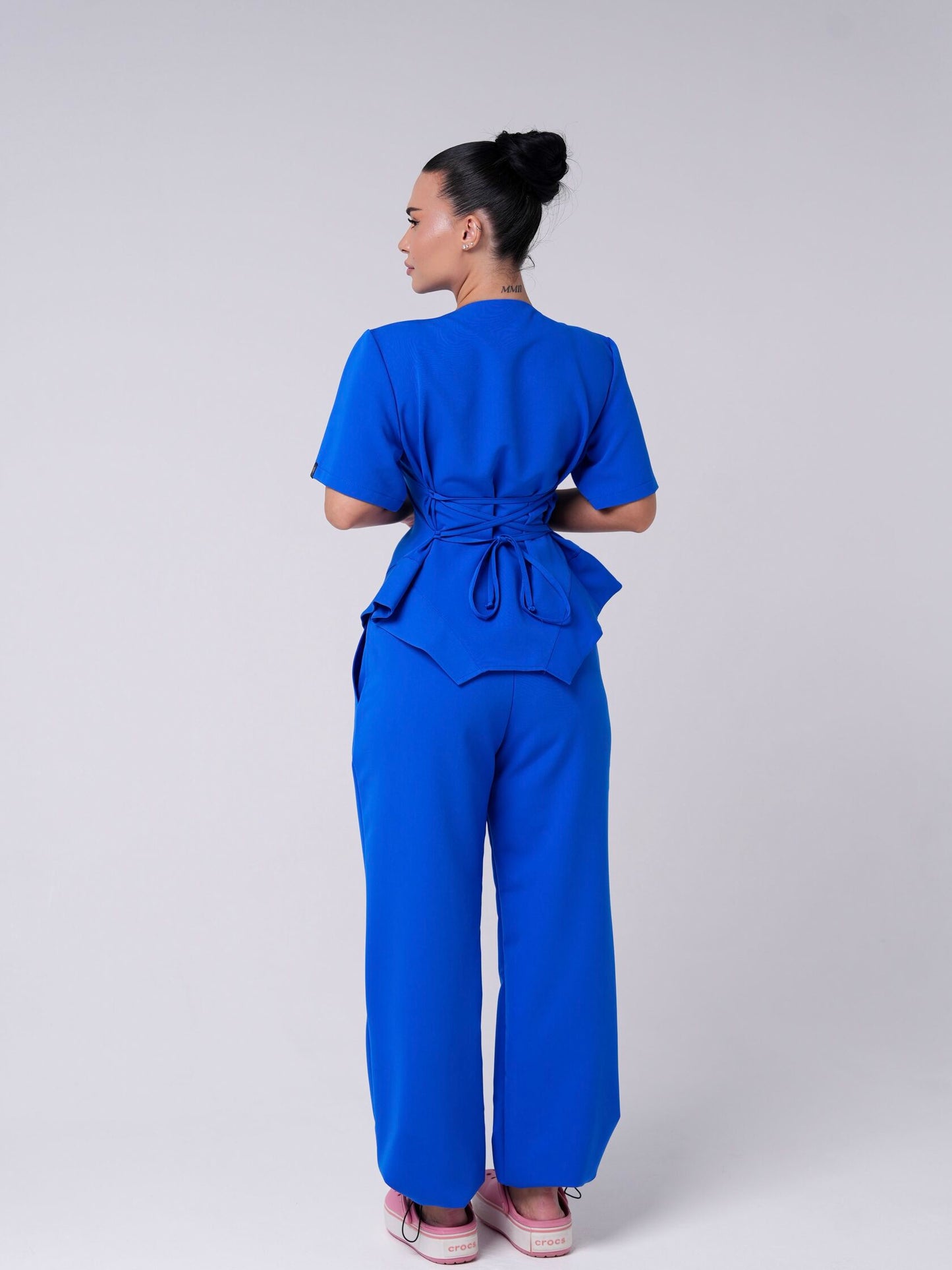 Lía — Uniforme con pantalón encauchado y corset