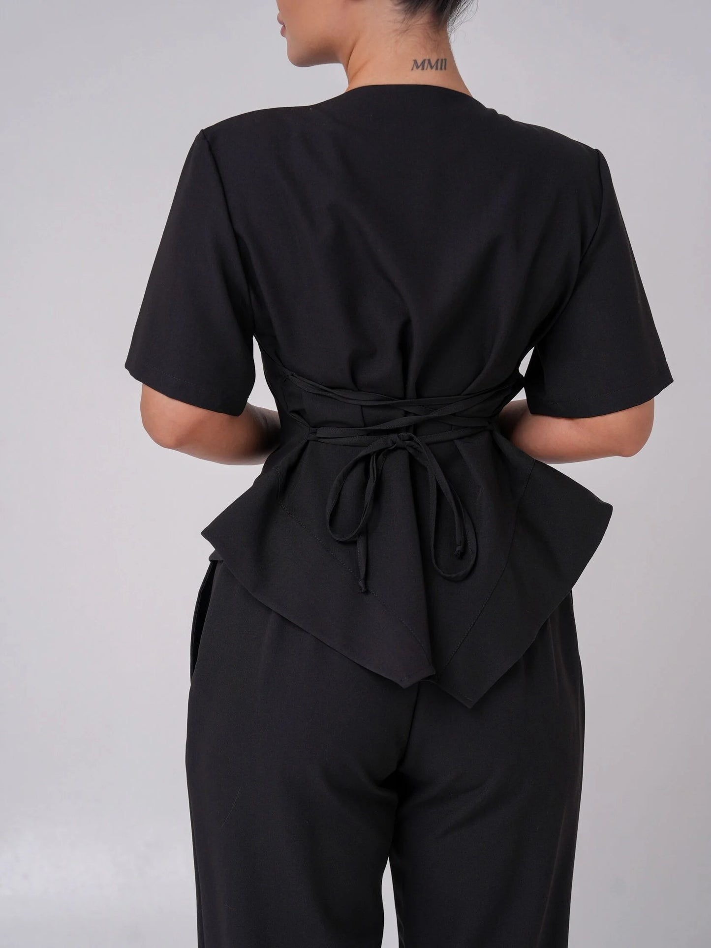 Lía — Uniforme con pantalón encauchado y corset
