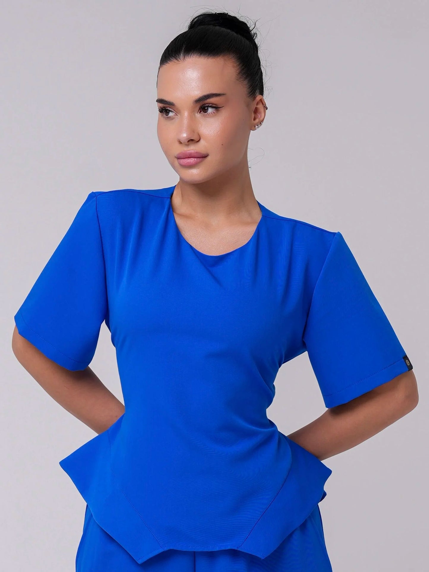 Lía — Uniforme con pantalón encauchado y corset