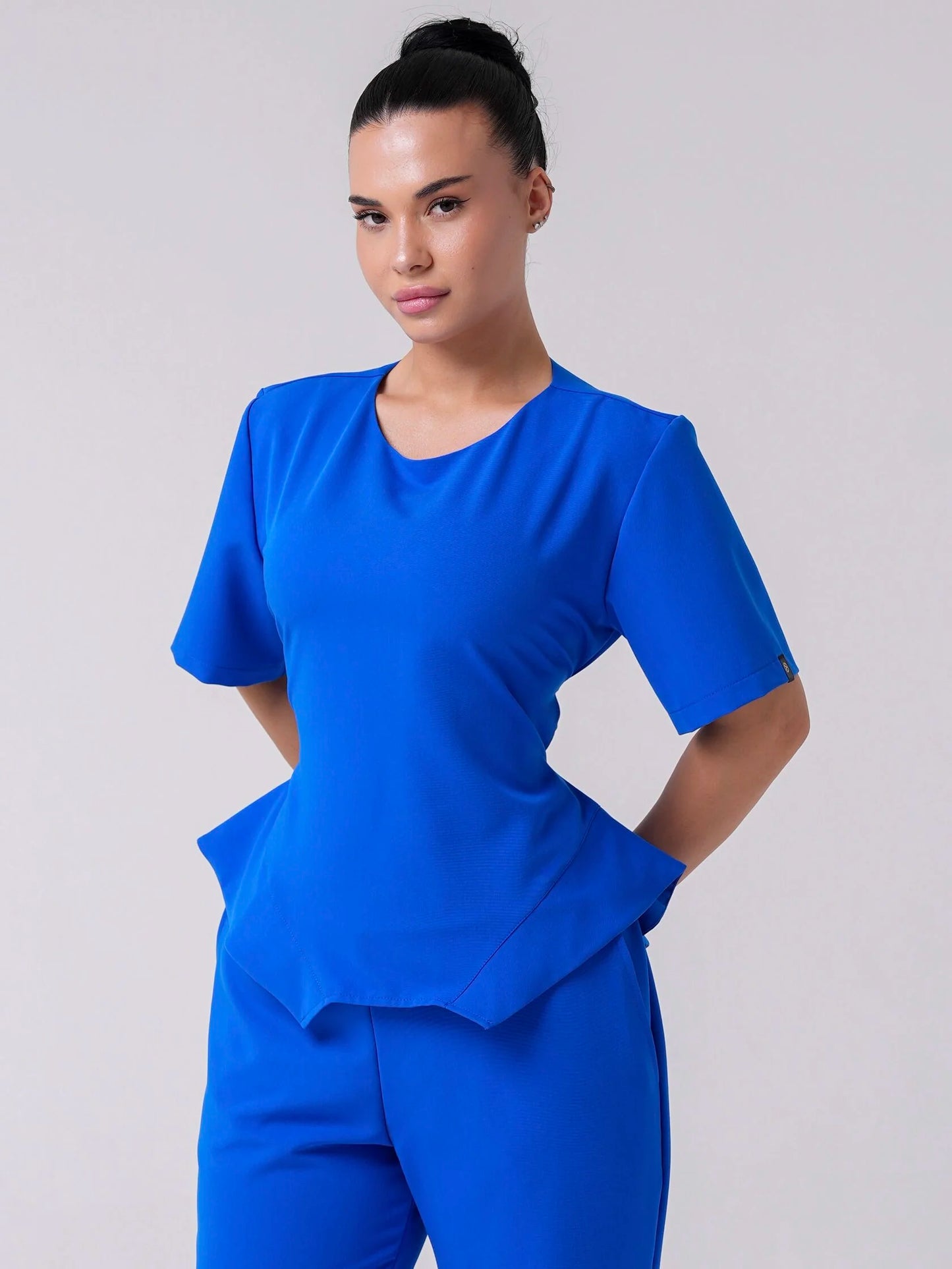 Lía — Uniforme con pantalón encauchado y corset