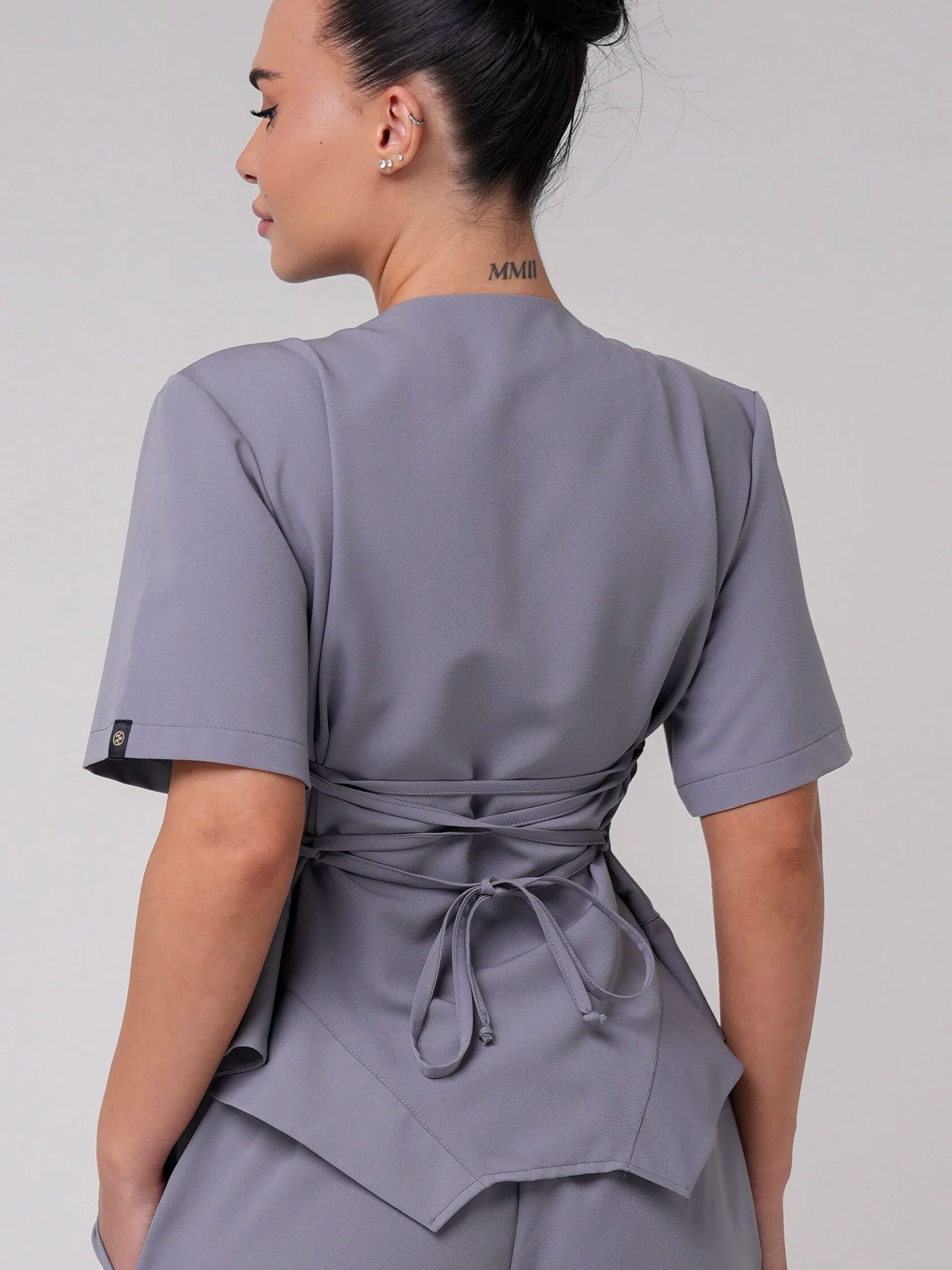 Lía — Uniforme con pantalón encauchado y corset