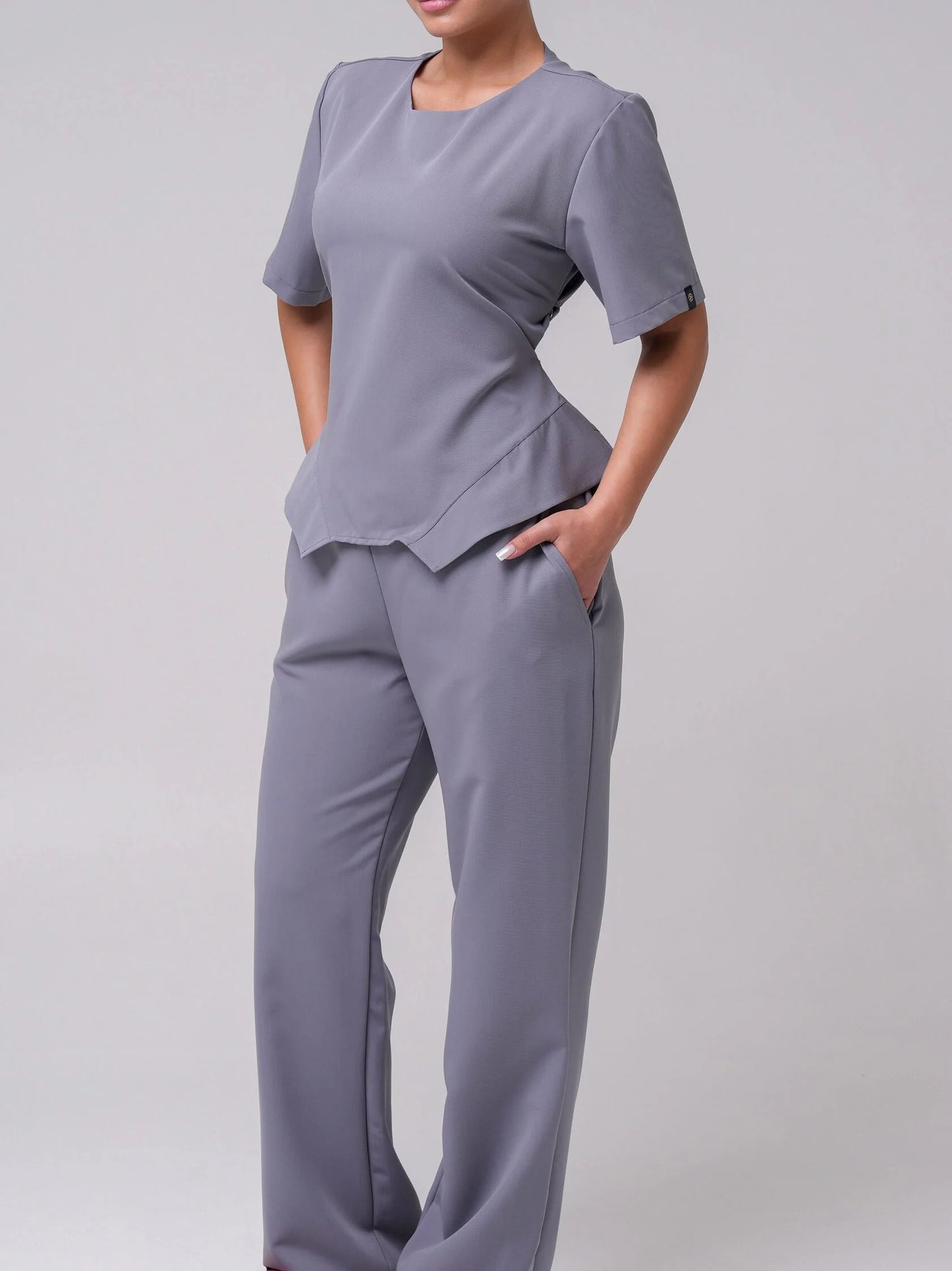 Lía — Uniforme con pantalón encauchado y corset