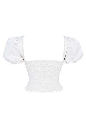 Saskia — Conjunto: blusa encauchada y falda short mini con lazo