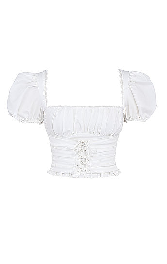 Saskia — Conjunto: blusa encauchada y falda short mini con lazo