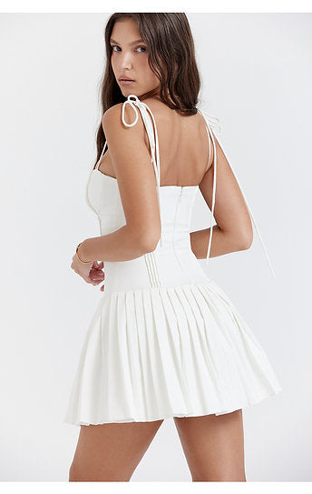 Vianne — Vestido mini con lazos y falda plisada